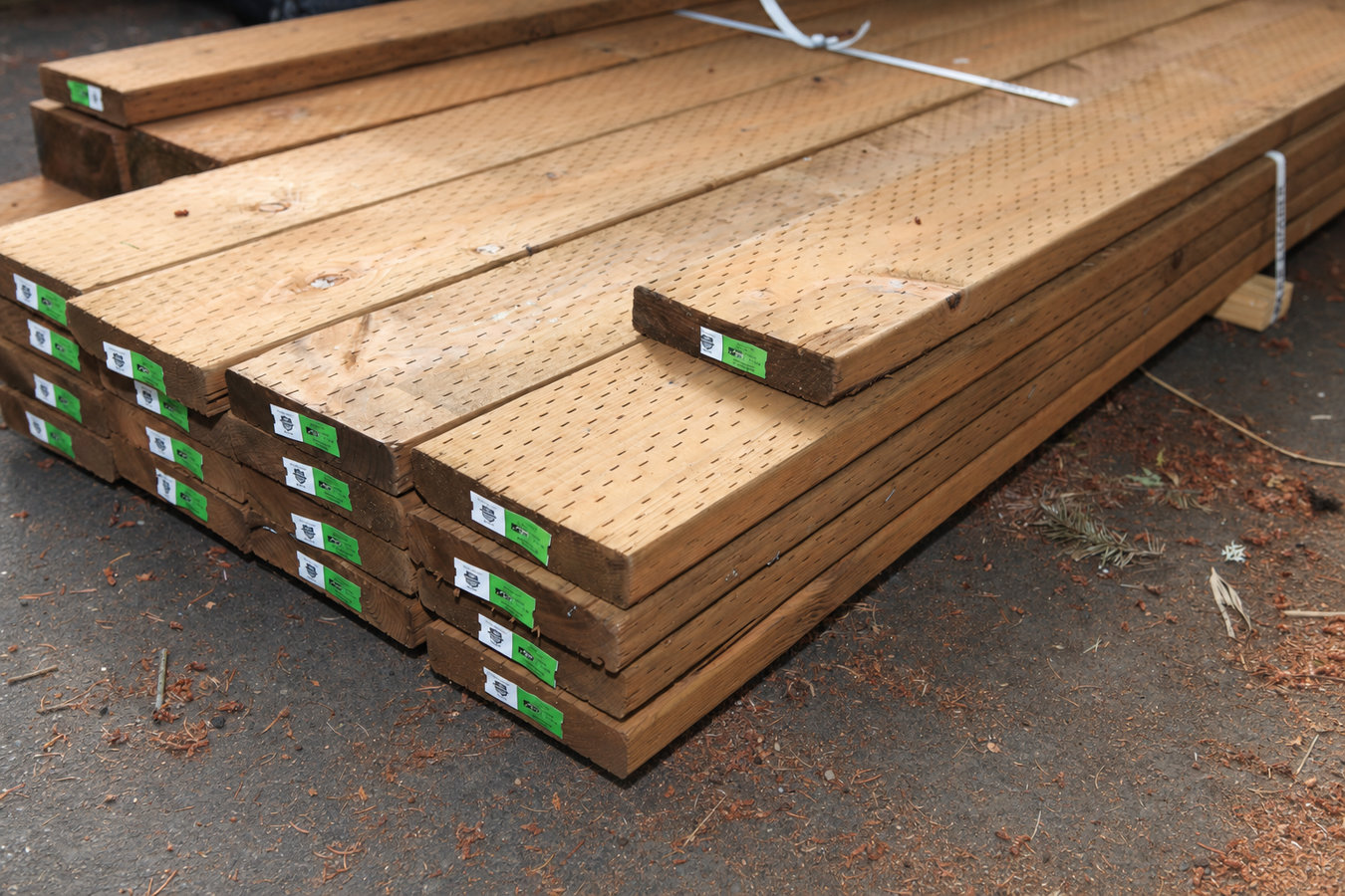 Pressure-treated wood deck construction